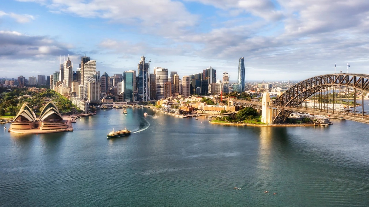 Ferry leaving Circular Quay between the Sydney Opera House and Harbour Bridge