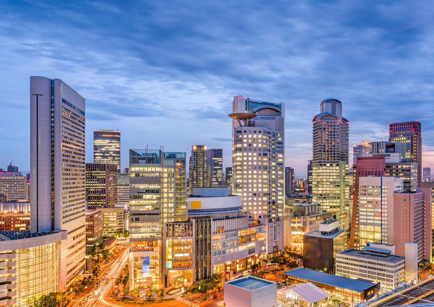 Umeda skyline and illuminated skyscrapers at dusk in Osaka